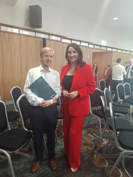 NIMTF Officer and Deputy First Minister, Emma Little-Pengelly stood beside each other at the DUP Party Conference