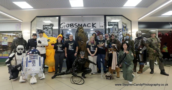 Cosplayers and the staff of the shop, gathered outside Gobsmack Comics in Horsham.