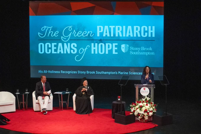 Me standing at the podium with a slide that reads "The Green Patriarch: Oceans of Hope" behind me.