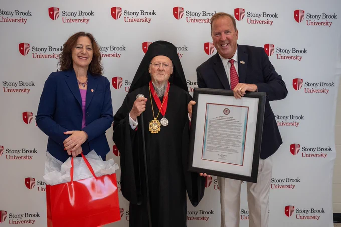 His Holiness, Kevin Law and me in front of a Stony Brook University step-and-repeat.