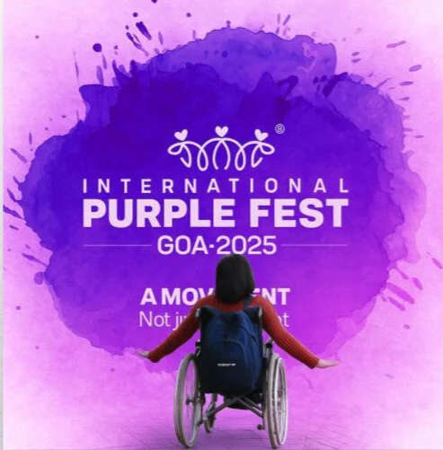 A woman in a wheelchair with open arms faces a purple backdrop that reads “International Purple Fest Goa 2025 – A Movement, Not just an Event.”