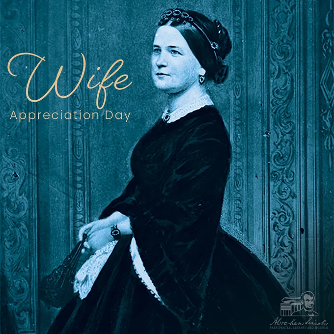 Illustration of Mary Lincoln in a dark dress with lace trim, wearing jewelry and holding a fan, with text reading “Wife Appreciation Day” beside her.