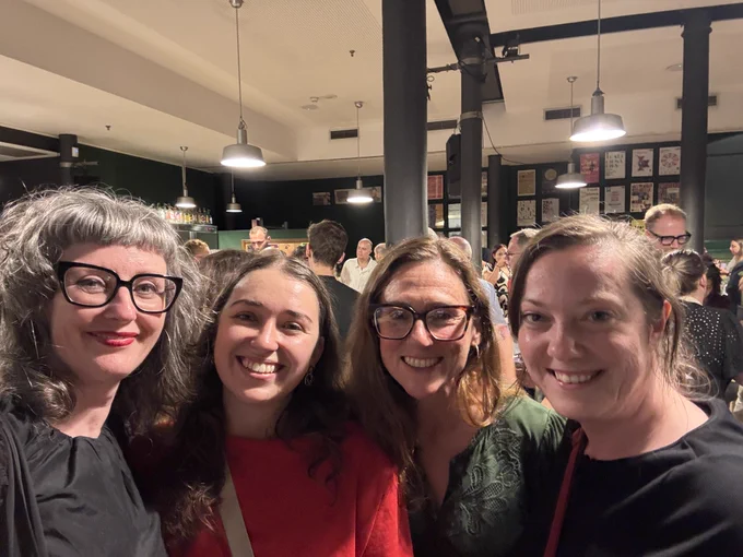 Four women smiling at party. Left to Right: Ali FitzGibbon from QUB; 3 other researchers from Queen Margaret's University Edinburgh