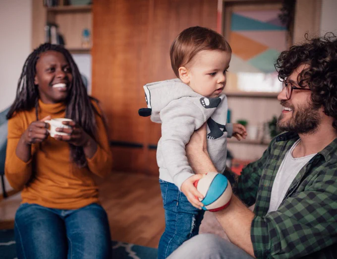 A Father holding a baby