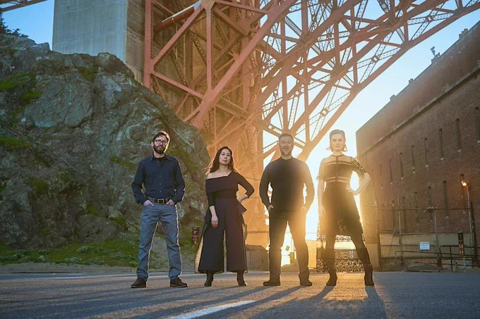 Members of the Del Sole Quartet at Fort Point, San Francisco, with the arch of the Golden Gate Bridge behind them. Left to right: Benjamin Kreith, Hyeyung Sol Yoon, Charlton Lee, and Kathryn Bates. Photo: AFW Productions & Chris Yeh (as listed).