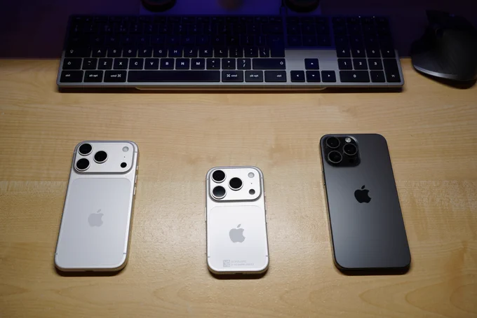 A comically small iPhone 17 Pro Mini with a 4.7 inch screen, in between a regular iPhone 17 Pro and an iPhone 15 Pro Max.