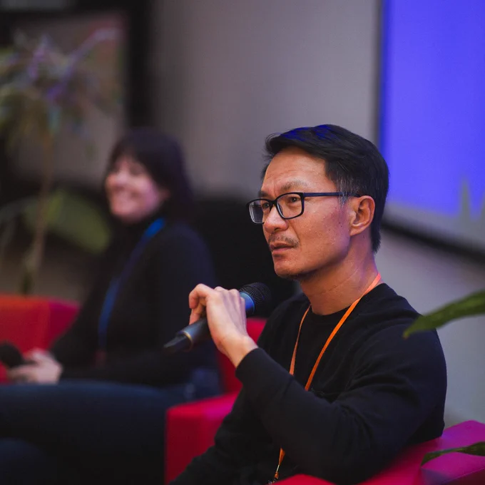 In the foreground, The Local editor-in-chief and publisher Tai Huynh co-leads a discussion on public policy and the independent press. He is joined by The Discourse CEO and publisher Brandi Schier in the background. 