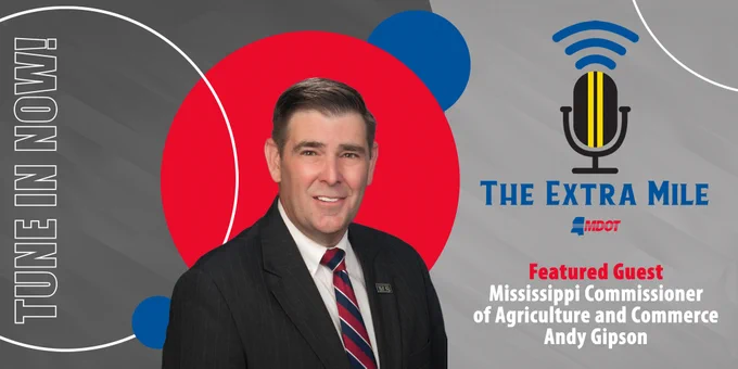 Promotional graphic for "The Extra Mile Podcast", featuring guest Mississippi Commissioner of Agriculture and Commerce Andy Gipson. The image includes a guest headshot, the Mississippi Department of Transportation (MDOT) logo, a microphone icon, and a red, blue, and gray abstract background. Text invites viewers to "TUNE IN NOW!"