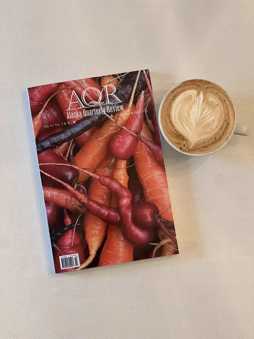 AQR cover—art is of carrots in various colors. Beside a cappuccino on a cream colored table cloth.