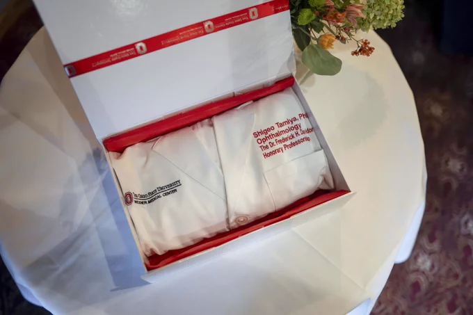 Dr. Tamiya's new white coat in opened box, showing Dr. Tamiya's new title