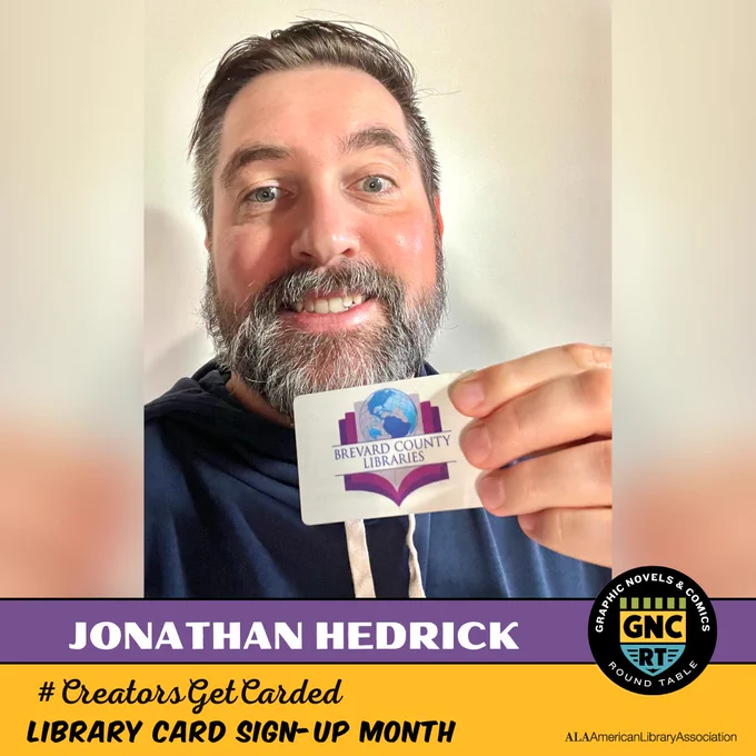Creator Jonathan Hedrick holding his Brevard County Library card.
