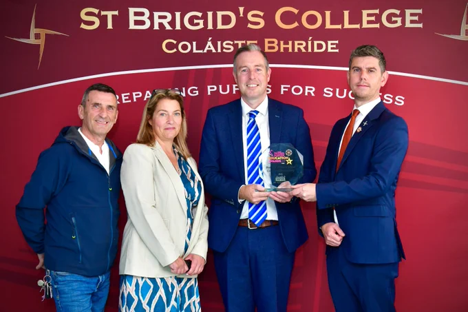 Image of Education Minister, Paul Givan with St Brigid's College Principal Sean McCay, pupils and Governor Michael Wilson