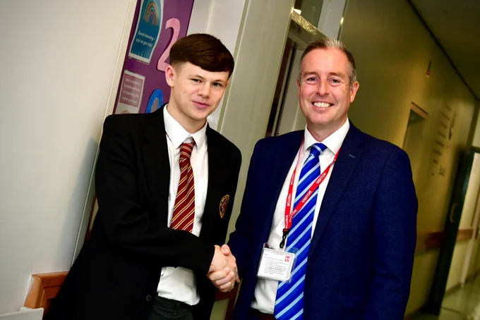 Image of Education Minister, Paul Givan with St Brigid's College pupil. 