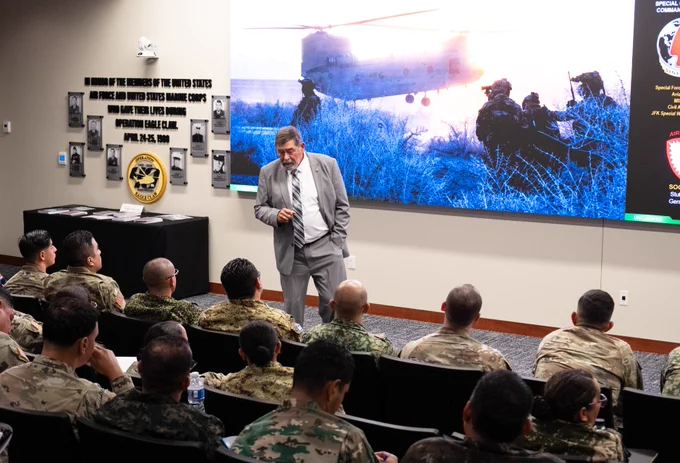 MG (RET) Simeon Trombitas, JSOU adjunct faculty, speaks to the WHINSEC visitors in JSOU’s Eagle Claw Auditorium. 