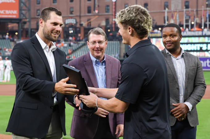Nate George receives his Orioles Minor League Player of the Year Award during a pregame ceremony.