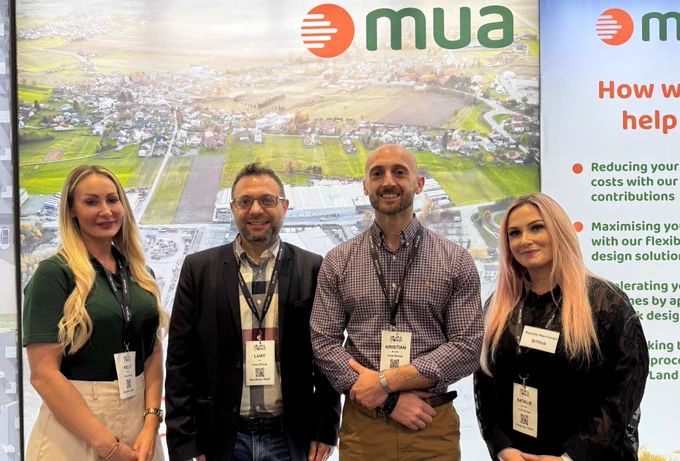 Four of our mua experts are standing in front of our stand at Solar and Storage Live