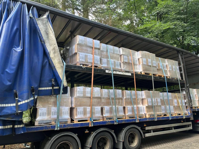 Heavy goods vehicle with straps securely holding down each pallet load as per DVSA guidance