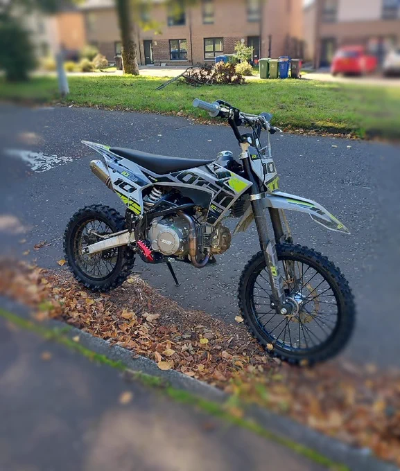 Image of an off-road bike which has been seized by police officers.