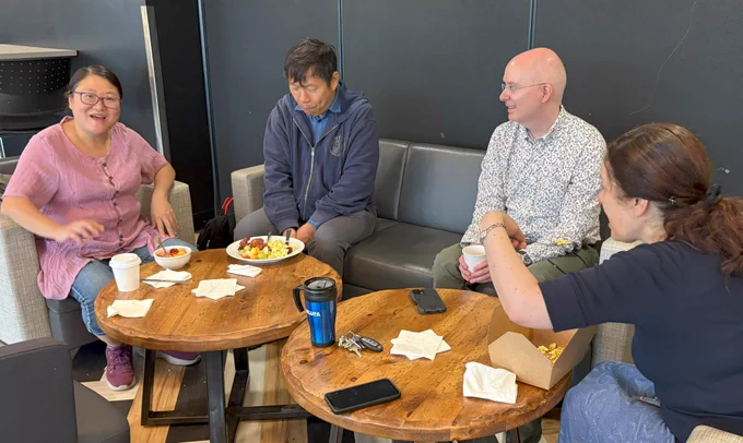 WLUFA's President, Bruce Gillespie, having a light lunch with three other WLUFA Members. 