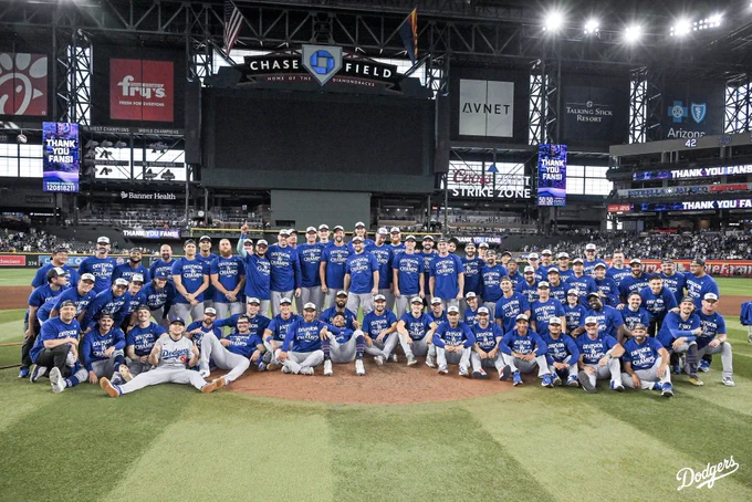 A photo of the entire team on the field after clinching the 2025 National League West title.