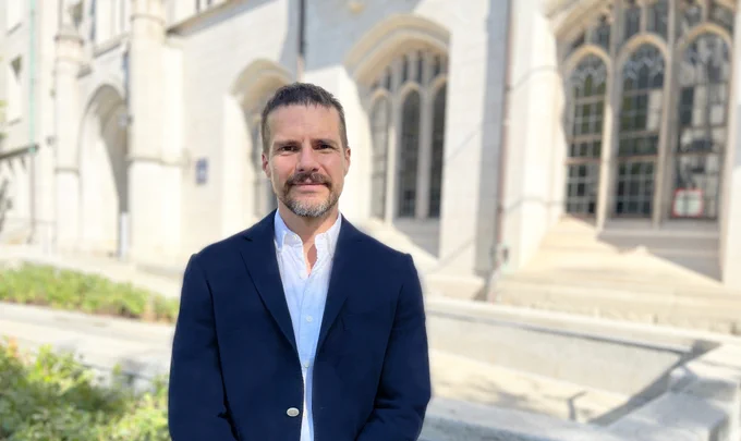 Daniel Karell stands outside the sociology building at Yale