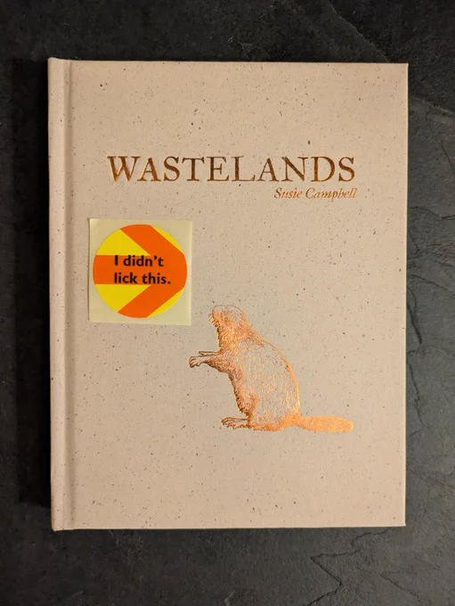 Cover of book with image of beaver and a yellow sticker with orange arrow.