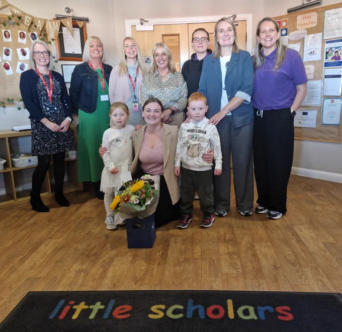 Natalie Don-Innes, Minister for Children, Young People and The Promise with staff and children from the nursery visit.