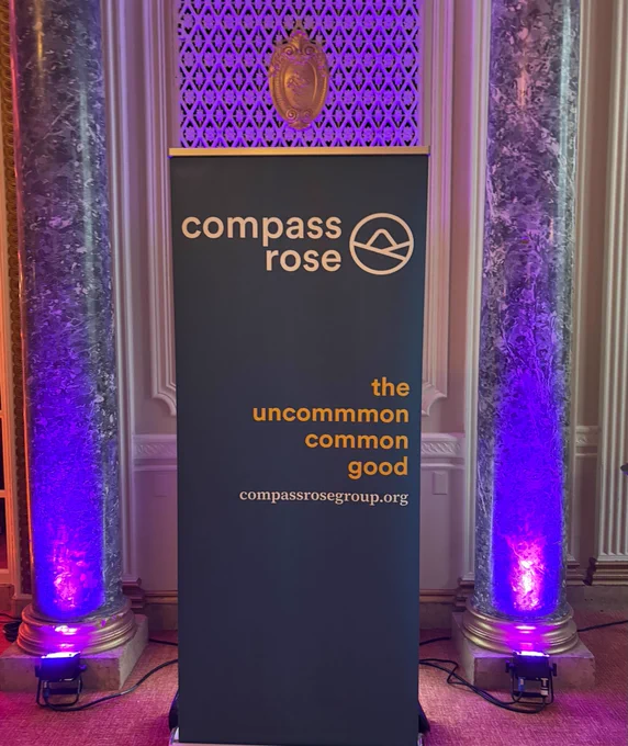 The Compass Rose banner inside the event.