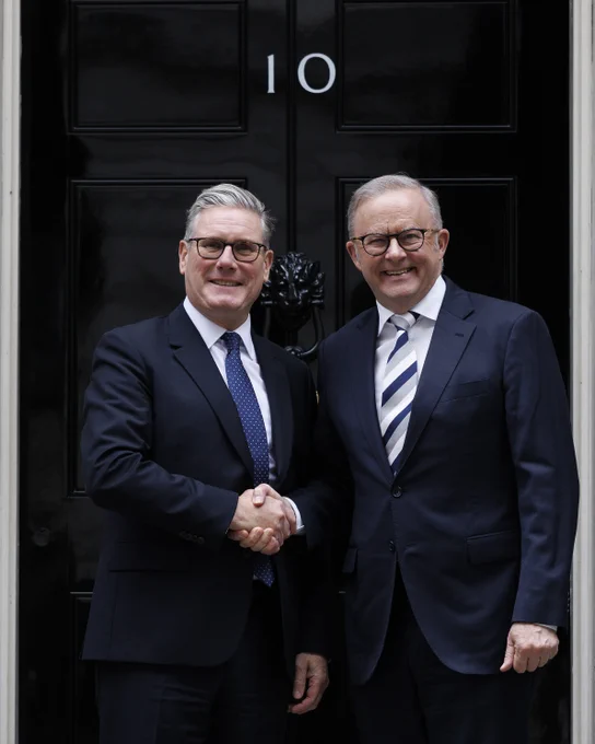 Keir Starmer and Anthony Albanese shake hands outside Downing Street.