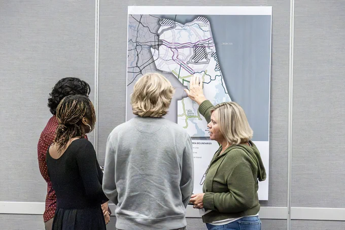 Attendees looking at a map