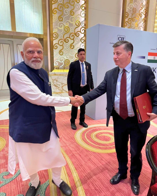 Scottish Secretary Douglas Alexander shaking hands with Narendra Modi Prime Minister of India
