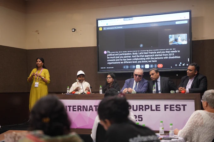 Image: This image features Hon’ble Minister Shri Subhash Phal Desai addressing the audience, with other dignitaries seated on stage during the session on International Collaboration and Globalization: Political Participation of Persons with Disabilities (PwDs) at the International Purple Fest Goa 2025.