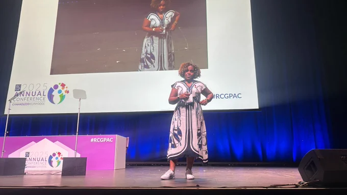 A photo Prof. Margaret Ikpoh on stage speaking at the Annual Conference. 