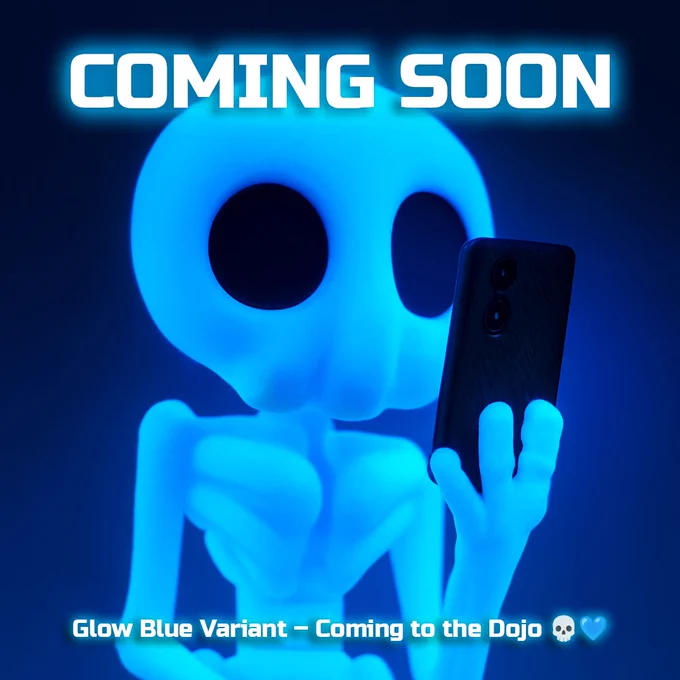 A Skeleton Hazy glowing bright blue in the dark while holding a phone. The image text reads “COMING SOON – Glow Blue Variant – Coming to the Dojo 💀💙.”