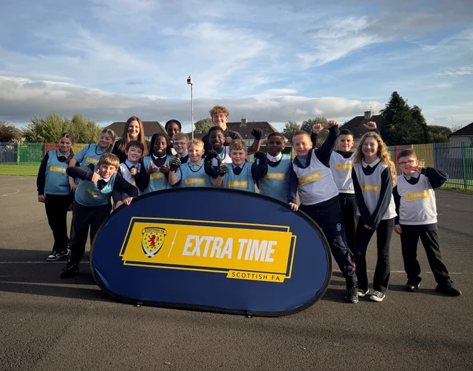 Children's Minister Natalie Don-Innes with children and a Motherwell FC Community Trust coach during a Scottish FA Extra Time visit.