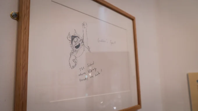 Original artwork framed on wall