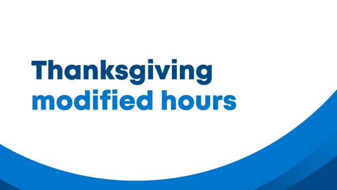 A white graphic with blue swoops along the bottom. The text on the graphic reads "Thanksgiving modified hours."