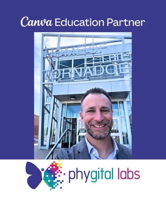  A person stands smiling in front of a building with large glass windows and a sign that reads "HOME OF THE TORNADOES." They are wearing a grey blazer over a light blue shirt. The image has a purple border with the text "Canva Education Partner" at the top and a colorful "Phygital Labs" logo featuring an abstract butterfly at the bottom.