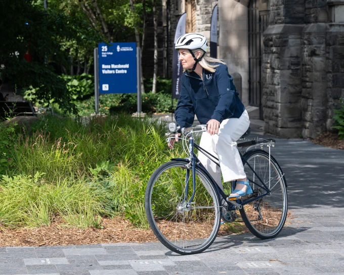 U of T President Melanie Woodin bikes to work (photo by Lisa Sakulensky)