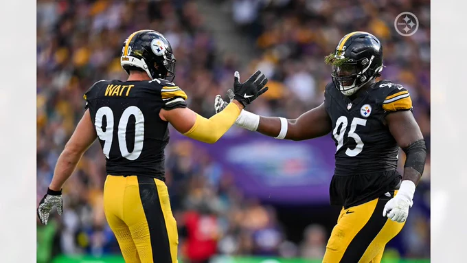 Pittsburgh Steelers LB #90 T.J. Watt and DL #95 Keeanu Benton celebrate during a Week Four game against the Minnesota Vikings 