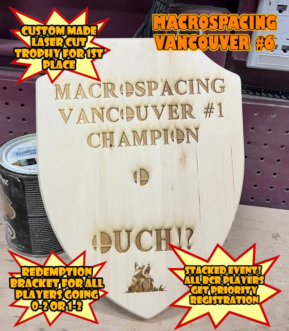 A picture of the custom made laser cut trophy for Macrospacing Vancouver #1. Image also has text bubbles indicating that a similar trophy will be made for Macrospacing Vancouver #6, that there will be a redemption bracket, and that BCR players get priority registration.
