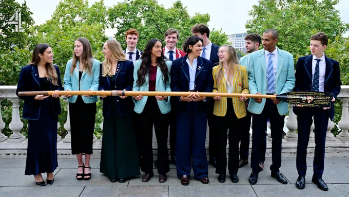Members of the Oxford Cambridge Boat Race 2026 teams holding an oar, smiling and chatting to each other casually at the Channel 4 Boat Race Announcement in London.