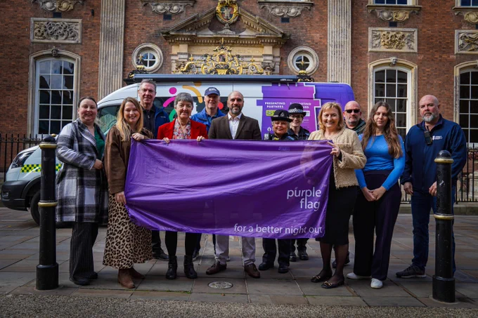 Representatives from Purple Flag partners Worcester Business Improvement District (Worcester BID), Worcester City Council, West Mercia Police, Worcester Street Pastors and Worcestershire Regulatory Services outside the Guildhall in Worcester