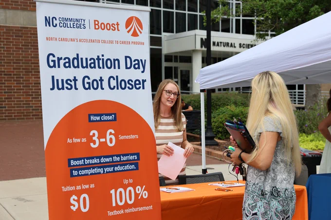 boost advisor speaking to student
