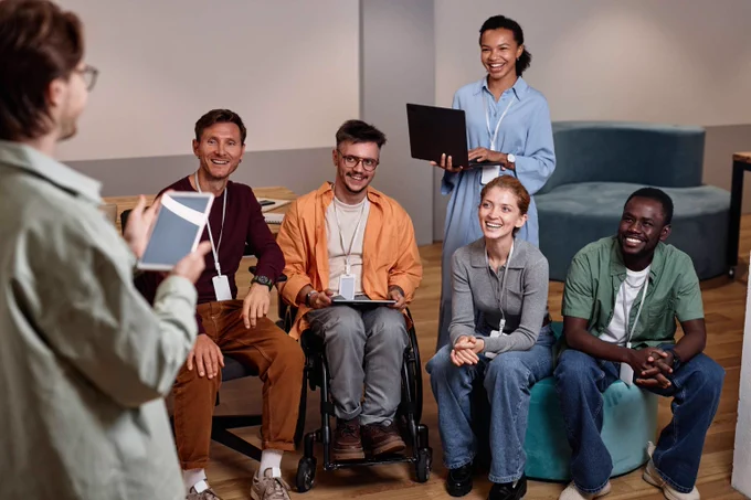 People attending a presentation in an office.