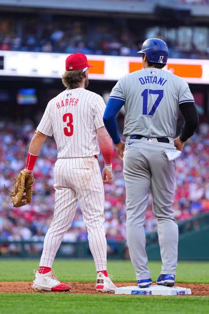 Bryce Harper and Shohei Ohtani standing at first base