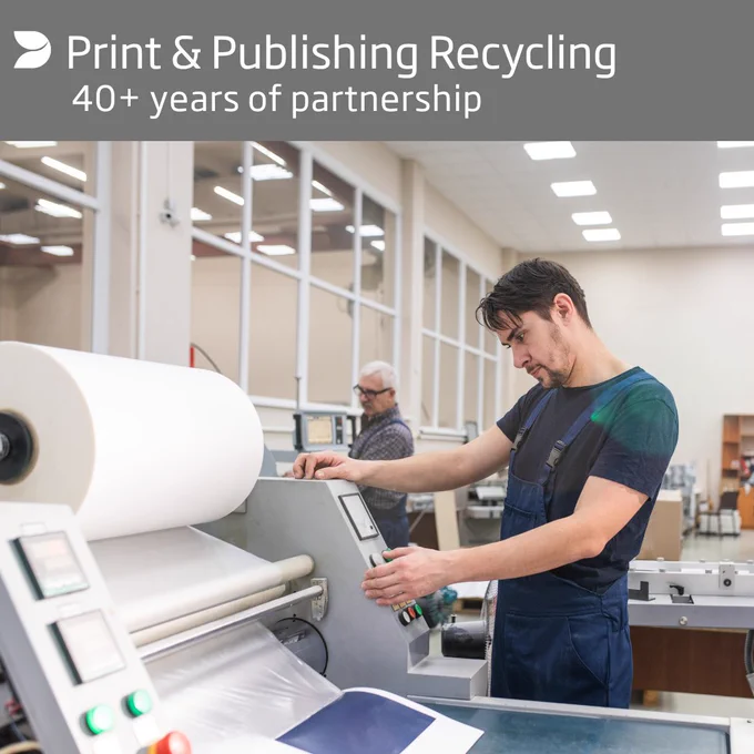 Worker operating a large printing machine in a spacious, well-lit industrial setting focused on print and publishing recycling.