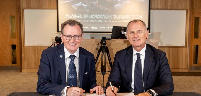 Image shows President and Vice Chancellor of Queen's Professor Sir Ian Greer and Professor Aleks Subic, Vice-Chancellor and Chief Executive of Aston University marking the announcement of the  Dual Award PhD Programme with an official signing at the Global Innovation Summit 2024 held at Queen's University Belfast