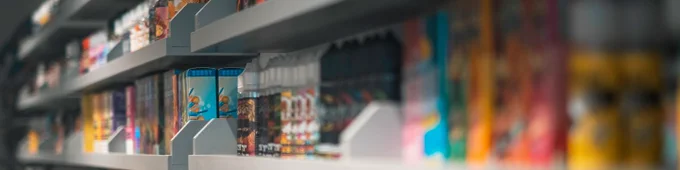 Photo of vapes on a shelf, in a Shop.
