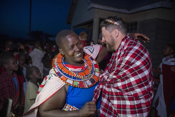 An Oltepesi Village community member and Freedom Forever Trekker dancing in celebration.